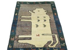 Surface texture of 2000s Persian Gabbeh rug with natural Wool and intricate pattern