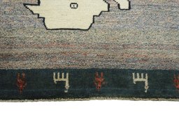 Central medallion detail of 2000s Persian Gabbeh rug from Iran / Persia