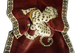 Corner detail of 2000s Persian Gabbeh rug showing border pattern and Wool pile