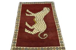 Surface texture of 2000s Persian Gabbeh rug with natural Wool and intricate pattern