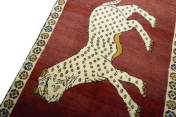 Backside of handmade 2000s Persian Gabbeh rug showing knot structure and weave density