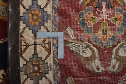 Surface texture of 2000s Persian Gabbeh rug with natural Wool and intricate pattern