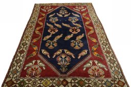 Surface texture of 2000s Persian Gabbeh rug with natural Wool and intricate pattern