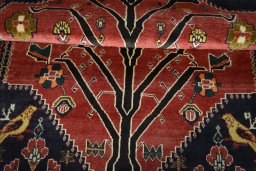 Full view of 2000s Persian Gabbeh rug from Iran / Persia, 190 × 137 cm in Red tones