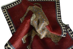 Corner detail of 2000s Persian Gabbeh rug showing border pattern and Wool pile