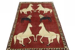 Surface texture of 2000s Persian Gabbeh rug with natural Wool and intricate pattern