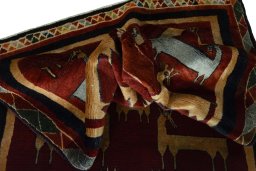 Corner detail of 2000s Persian Gabbeh rug showing border pattern and Wool pile