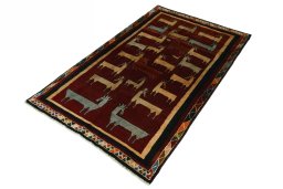 Corner detail of 2000s Persian Gabbeh rug showing border pattern and Wool pile