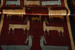 Full view of 2000s Persian Gabbeh rug from Iran / Persia, 208 × 126 cm in Red tones