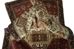 Corner detail of 2000s Persian Gabbeh rug showing border pattern and Wool pile