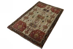 Corner detail of 2000s Persian Gabbeh rug showing border pattern and Wool pile