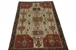 Surface texture of 2000s Persian Gabbeh rug with natural Wool and intricate pattern