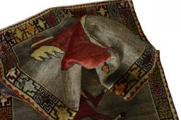 Corner detail of 2000s Persian Gabbeh rug showing border pattern and Wool pile