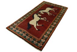 Corner detail of 2000s Persian Gabbeh rug showing border pattern and Wool pile