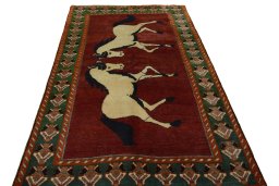 Surface texture of 2000s Persian Gabbeh rug with natural Wool and intricate pattern