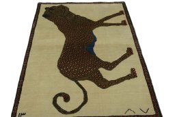 Surface texture of 2000s Persian Gabbeh rug with natural Wool and intricate pattern