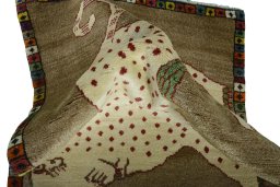 Corner detail of 2000s Persian Gabbeh rug showing border pattern and Wool pile