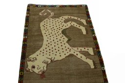 Surface texture of 2000s Persian Gabbeh rug with natural Wool and intricate pattern