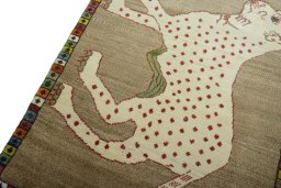 Backside of handmade 2000s Persian Gabbeh rug showing knot structure and weave density