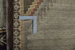Surface texture of 2000s Persian Gabbeh rug with natural Wool and intricate pattern