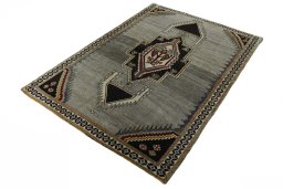 Corner detail of 2000s Persian Gabbeh rug showing border pattern and Wool pile