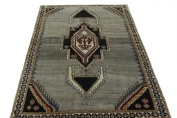 Surface texture of 2000s Persian Gabbeh rug with natural Wool and intricate pattern