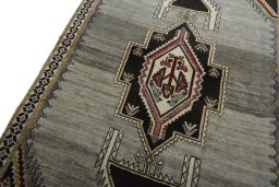 Backside of handmade 2000s Persian Gabbeh rug showing knot structure and weave density