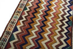 Backside of handmade 2000s Persian Gabbeh rug showing knot structure and weave density