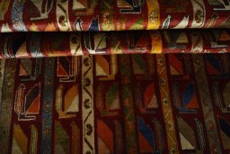 Corner detail of 2000s Persian Gabbeh rug showing border pattern and Wool pile