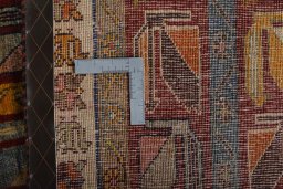 Surface texture of 2000s Persian Gabbeh rug with natural Wool and intricate pattern