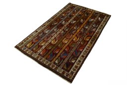 Corner detail of 2000s Persian Gabbeh rug showing border pattern and Wool pile