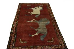 Surface texture of 2000s Persian Gabbeh rug with natural Wool and intricate pattern