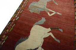 Backside of handmade 2000s Persian Gabbeh rug showing knot structure and weave density