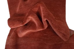 Corner detail of New Persian Gabbeh rug showing border pattern and Wool pile