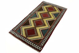 Corner detail of 2000s Persian Gabbeh rug showing border pattern and Wool pile