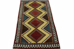 Surface texture of 2000s Persian Gabbeh rug with natural Wool and intricate pattern