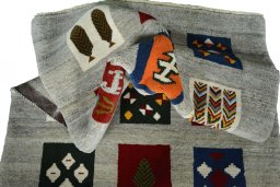 Corner detail of New Persian Gabbeh rug showing border pattern and Wool pile