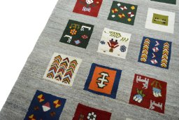 Backside of handmade New Persian Gabbeh rug showing knot structure and weave density