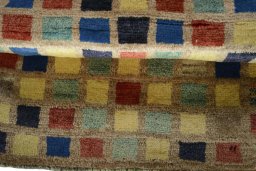 Full view of 2000s Persian Gabbeh rug from Iran / Persia, 104 × 67 cm in Multi Color tones