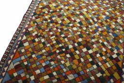 Backside of handmade 2000s Persian Gabbeh rug showing knot structure and weave density