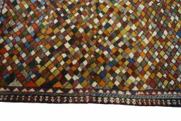 Close-up detail of 2000s Persian Gabbeh rug from Iran / Persia showing Wool weave