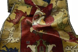 Corner detail of 2000s Persian Gabbeh rug showing border pattern and Wool pile