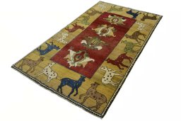 Corner detail of 2000s Persian Gabbeh rug showing border pattern and Wool pile