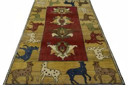 Surface texture of 2000s Persian Gabbeh rug with natural Wool and intricate pattern