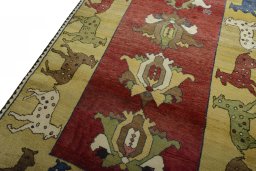 Backside of handmade 2000s Persian Gabbeh rug showing knot structure and weave density