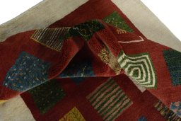 Corner detail of New Persian Gabbeh rug showing border pattern and Wool pile