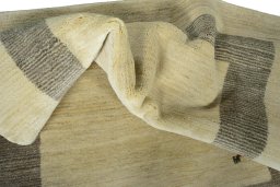Corner detail of New Persian Gabbeh rug showing border pattern and Wool pile