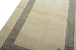 Backside of handmade New Persian Gabbeh rug showing knot structure and weave density