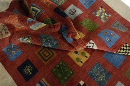 Corner detail of New Persian Gabbeh rug showing border pattern and Wool pile