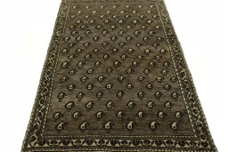 Surface texture of 2000s Persian Gabbeh rug with natural Wool and intricate pattern